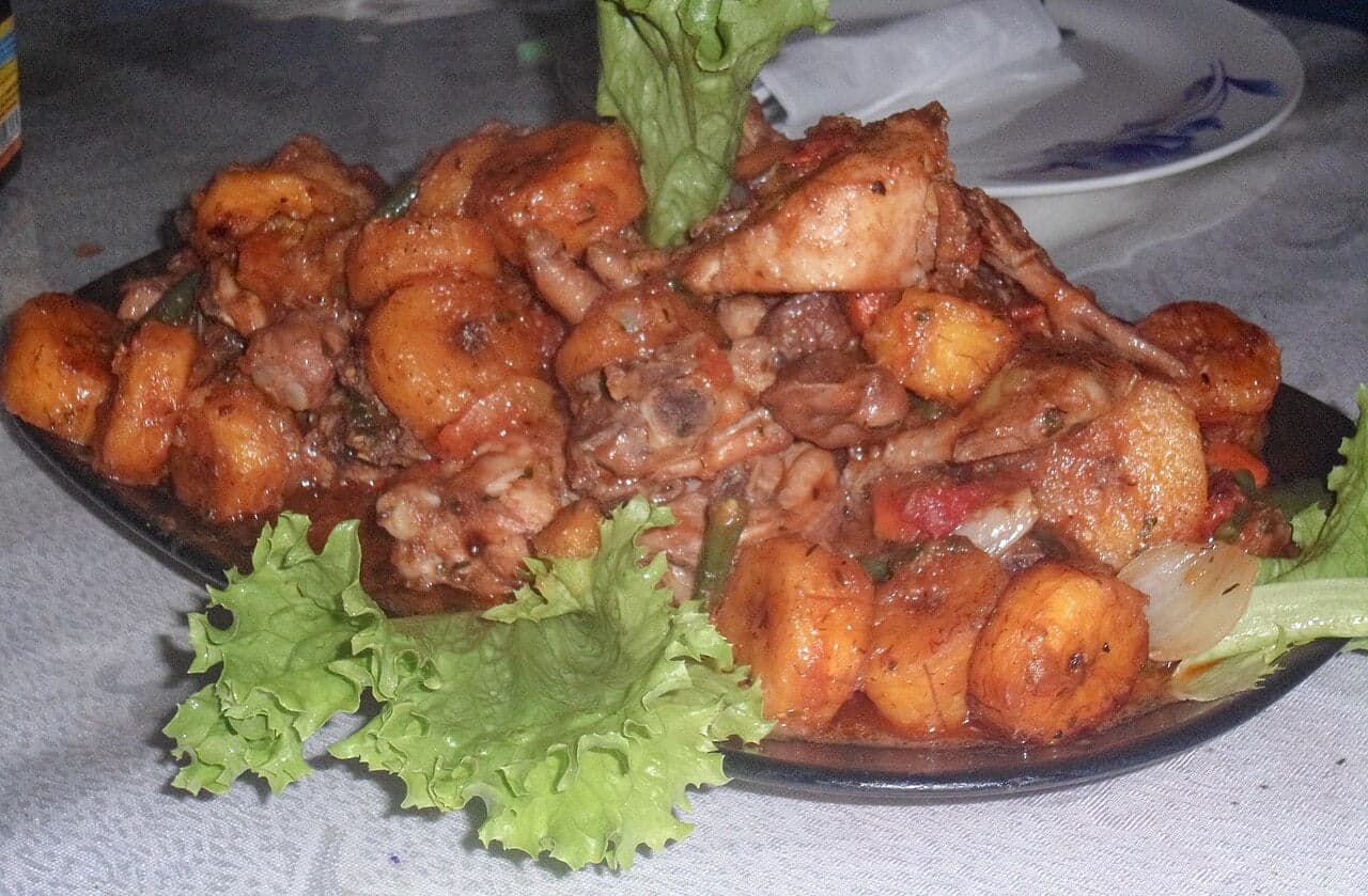 Poulet DG - chicken pieces cooked with plantain and vegetables in a rich sauce