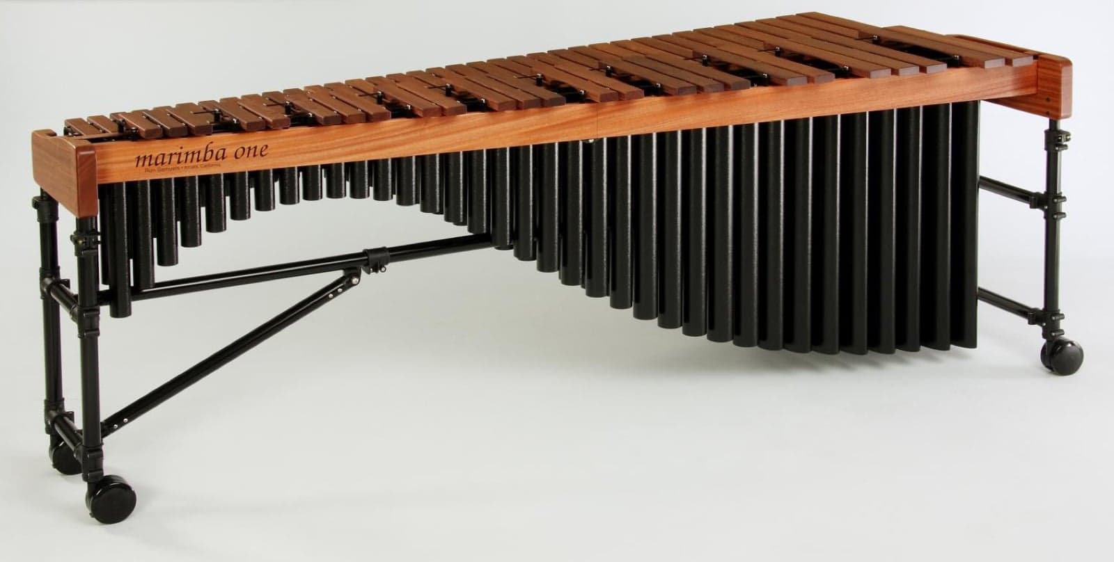 Two musicians playing a wooden marimba together