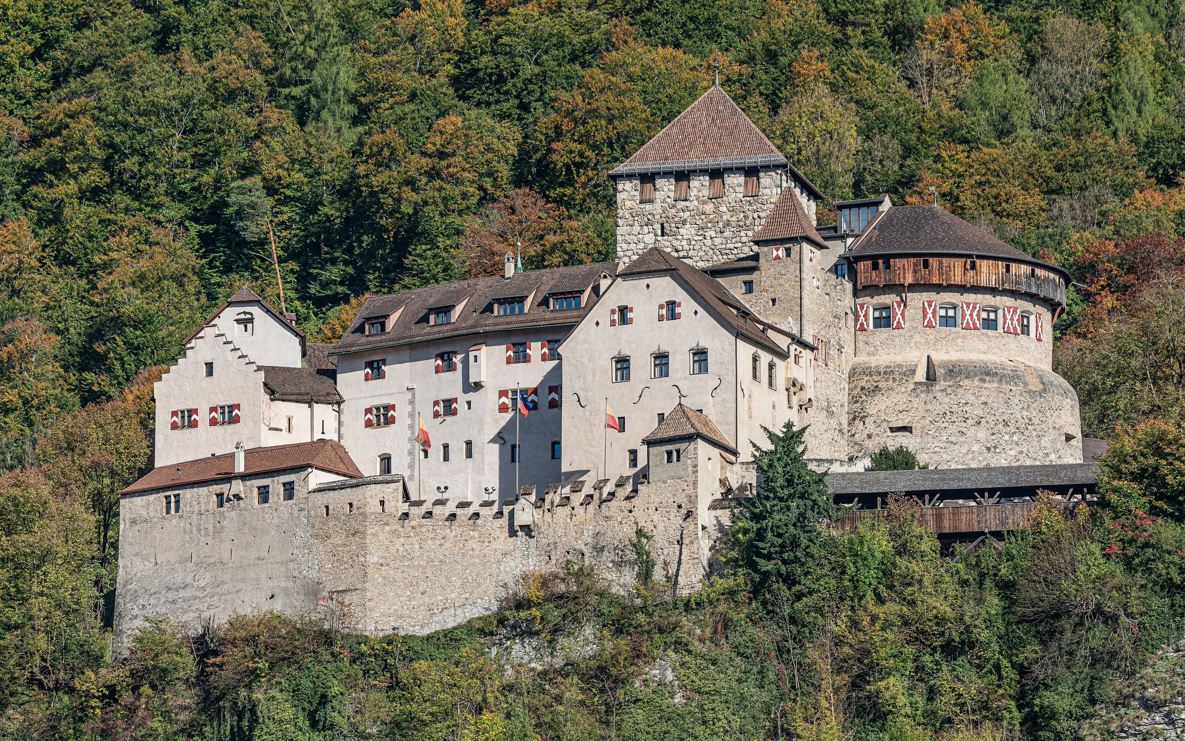 Vaduz Castle perched on a green cliff above the city of Vaduz