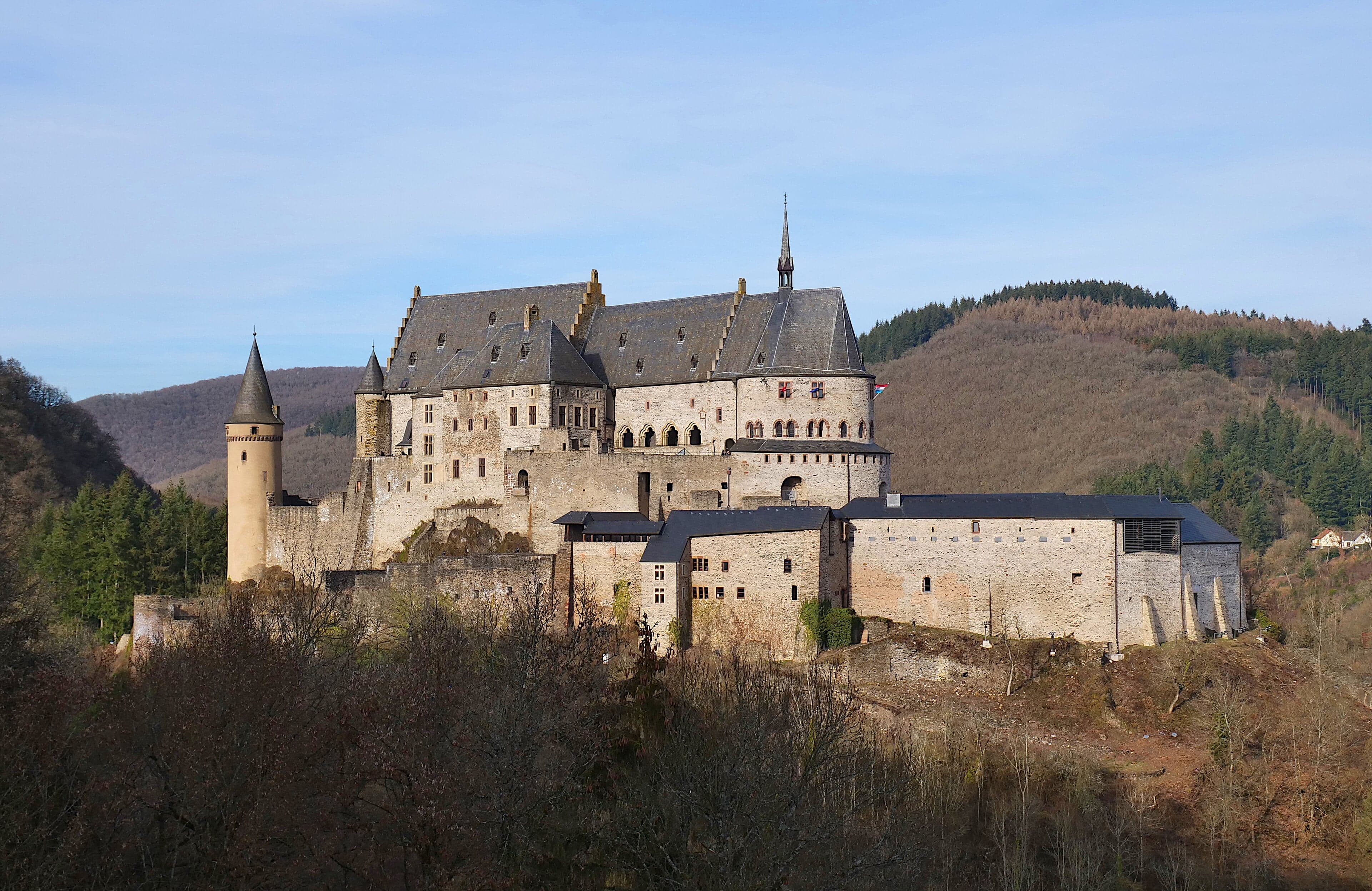 Vianden Castle rising above the Our river valley in autumn