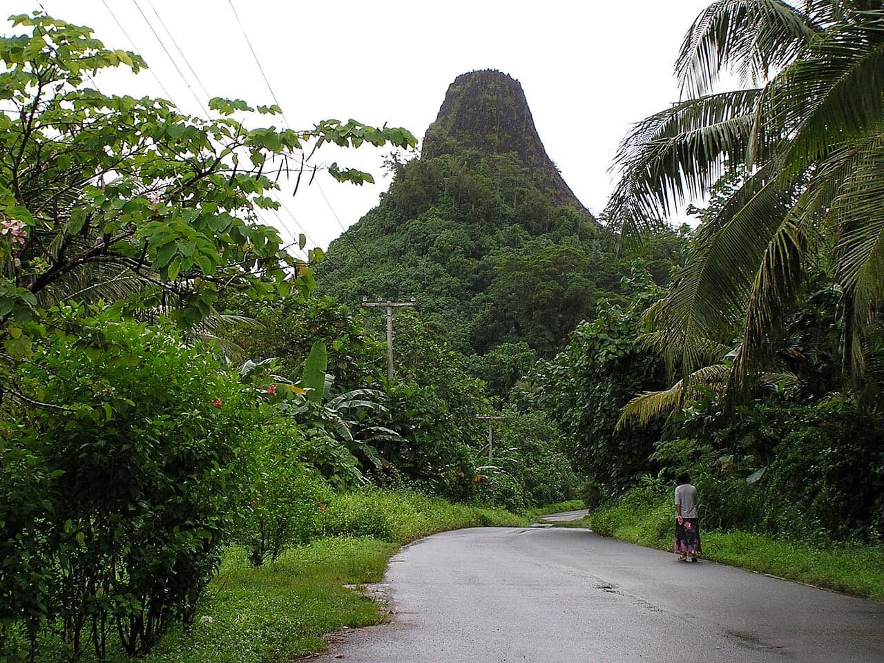 A waterfall tumbling through thick green rainforest on Pohnpei island