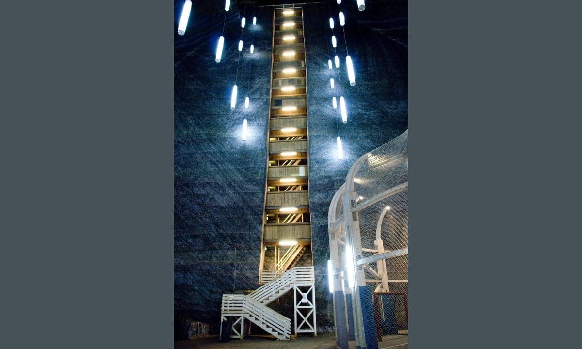 The vast underground chamber of Salina Turda salt mine with a Ferris wheel