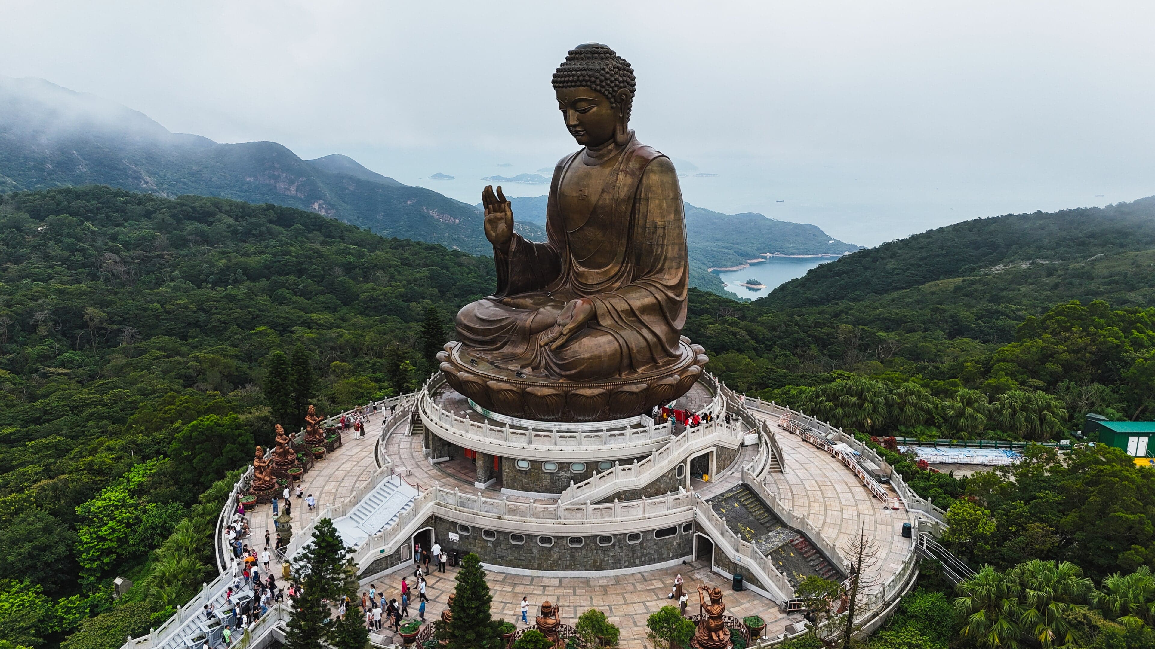 The Tian Tan Big Buddha statue sitting on a hilltop on Lantau Island